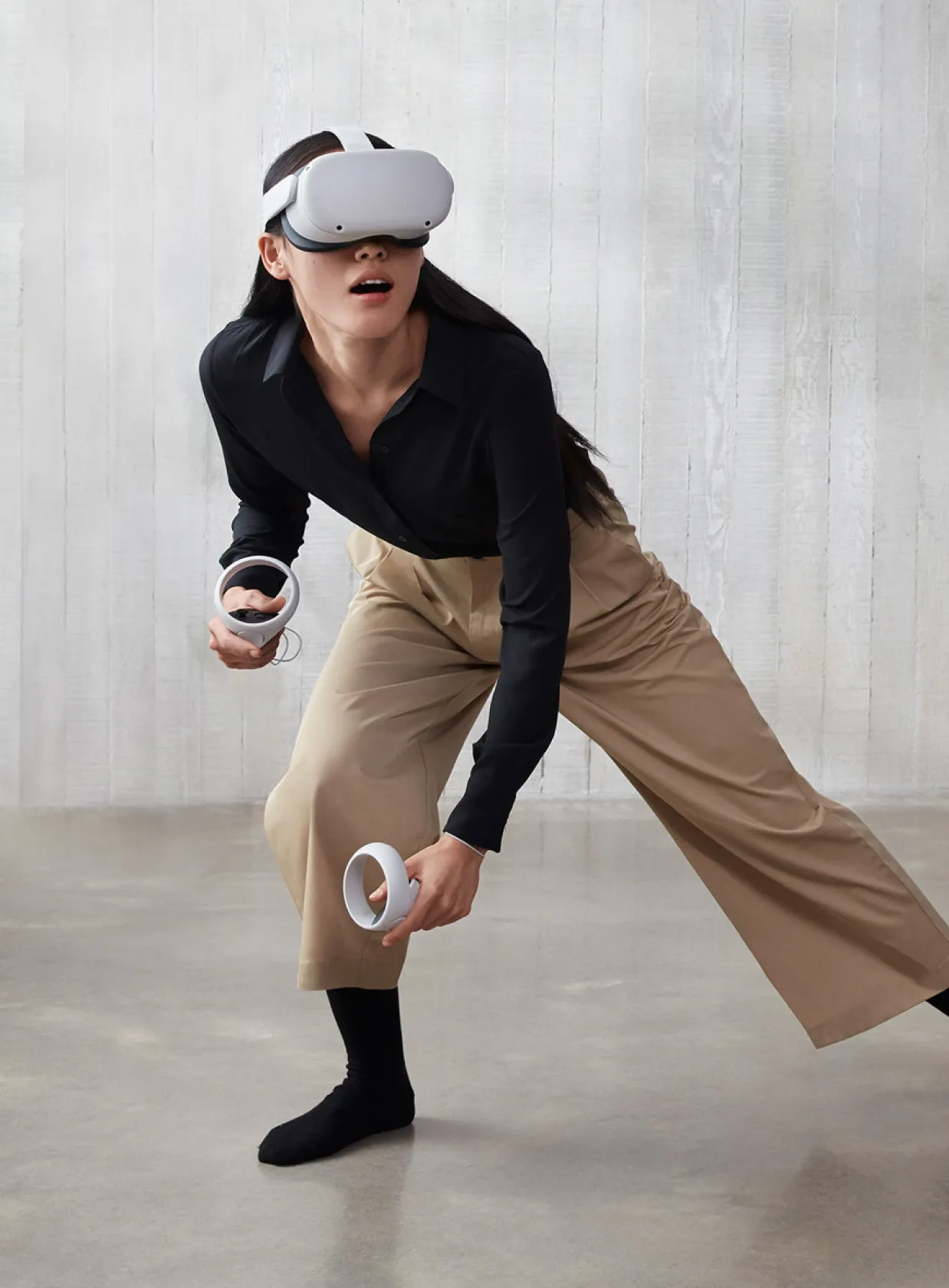 A dancer playing in an Oculus Quest 2 headset